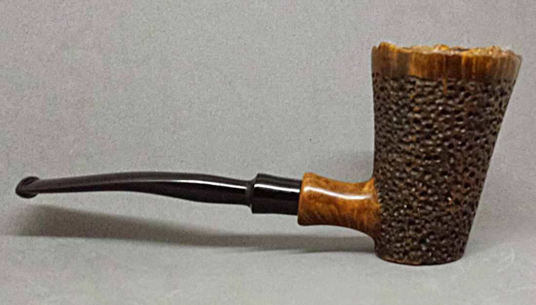 Close-up of a tobacco pipe with textured bowl and smooth curved black stem, neutral gray background, calm mood